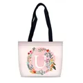 Pink canvas tote bag with letter U floral wreath print and black handles - Style U