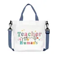White canvas tote bag with blue straps featuring Teacher of tiny Humans text print - Teacher of Tiny Humans Style (04)