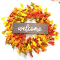 Fall harvest wreath with orange leaves, mini pumpkins and a wooden welcome sign - Autumn Harvest Wreath With Welcome Sign
