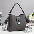 Chic dark grey multi-layer bucket bag with silver teardrop clasp and woven strap - Gray