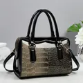 Elegant black patent leather shoulder bag with gold crocodile texture and metal handles - Khaki