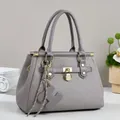 Gray large tote bag with geometric H-pattern embossing and gold hardware detail - Gray