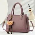 Retro Boston bag in dusty pink faux leather with plush bear charm and crossbody strap - Purple