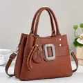 Brown embossed leather tote with diamond buckle and detachable shoulder strap - Earthy Yellow