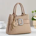 Elegant beige tote bag with geometric embossing and diamond-encrusted strap detail - Khaki