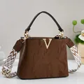 Brown oil-wax leather handbag with gold V metal logo and patterned wide strap - Coffee