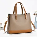 Taupe and tan leather handbag with large capacity and detachable crossbody strap - Khaki
