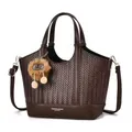 Brown woven tote bag with smooth leather handles and a plush pompom pendant on white background - Coffee