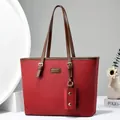 Elegant red leather tote bag with brown handles and pebble texture for women - Wine Red