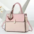 Detail of pink and beige tote bag with decorative checkered scarf and gold hardware - Pink