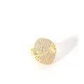 Macro detail of gold geometric ring featuring pave-set diamonds and openwork design - Radial Hollow Oval (W-816-4)