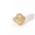 Macro shot of gold-plated geometric flower ring featuring intricate pavé-set crystals - Hollow Flower Mandala (W-816-1)