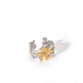 Detailed macro view of dual-tone gold and silver floral stainless steel ring - Matte Hollow Floral Style (38-DQ-W-1806)