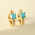 Detail of gold hoop earrings featuring square turquoise stones and micro-pave zircons - Blue Square