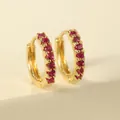 Elegant gold hoop earrings featuring a row of shimmering red cubic zirconia stones - Rose Red Hoop