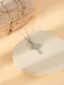 Close-up detail of the dazzling diamond-inlaid cross necklace with elegant crown design. - W1501 Cross Style 5