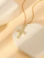 Close-up of a gold-plated cross pendant necklace featuring sparkling cubic zirconia stones. - W1499 Cross Style 9
