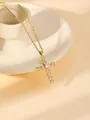 Detail shot of a dainty gold-plated stainless steel cross necklace with sparkling crystal stones. - W1495 Cross Style 19