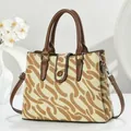 Vintage patterned canvas tote bag with brown leather handles and adjustable shoulder strap - Apricot