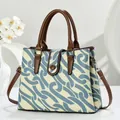 Chic blue and white patterned canvas tote bag with brown leather handles and strap - Blue