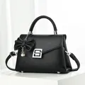Elegant black lychee pattern leather handbag with pearl bow charm and silver square buckle - Black