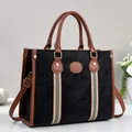 Minimalist black and brown contrast tote bag with large capacity for commuting - Black
