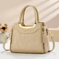 Elegant beige leather handbag for women featuring stylish vertical textured patterns - Apricot