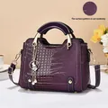 Deep purple crocodile pattern handbag with gold hardware and elegant bunny charm accessory - 23x10x18cm / Purple