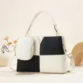 Detail of checkered tote bag with a small white purse and metallic V-shaped buckle - Off White
