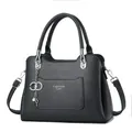Litchi pattern leather handbag for women with silver pearl charm and shoulder strap - Gray