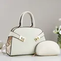 Detail view of beige shell crossbody bag with matching coin purse and gold hardware - White