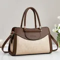 Detail of two-tone brown and beige PU leather handbag with gold metal hardware - L30 W13 H20 Handle16 / Khaki