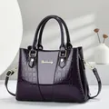 Elegant dark purple patent leather handbag for women featuring stylish crocodile texture - Purple