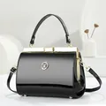 Elegant black patent leather handbag with gold metal frame and W logo for women - Glossy Patent Style / Black