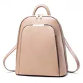 Detail of beige faux leather backpack showing large main compartment and front zip pocket - One Size / Khaki