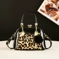 Fashionable leopard print and black patent leather shell handbag with gold hardware - Leopard Pale Yellow