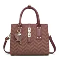 Elegant burgundy crossbody handbag with textured fabric and gold heart pendant - Red