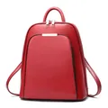 Modern red leather backpack for women featuring a minimalist design and silver metal trim - One Size / Red