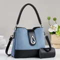 Blue matte fashion handbag with black leather handles and silver water drop metal lock - Blue