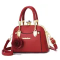 Red leather shell bag with gold metal frame, diamond clasp and rose charm detail - Red