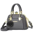 Detail of grey vintage shell bag featuring gold metal frame and crystal clasp buckle - Gray