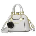 Close-up of white shell bag with oversized faux diamond clasp and black rose charm - White