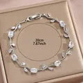 Silbernes Blatt-Armband mit Zirkonia-Steinen auf einer Champagner-Geschenkbox - Klarer Edelstein Silberrebe Stil (DQ-W-2667)