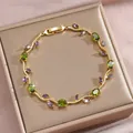 Goldenes Armband in Rankenform mit grünen ovalen und lila marquisefarbenen Zirkonia - Grüner und Lila Edelstein Goldrebe Stil(DQ-W-3314-1)