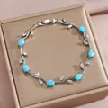 Silbernes Blatt-Armband mit himmelblauen Ovalsteinen und weißen Zirkonia - Himmelblauer und Weißer Edelstein Silberrebe Stil(DQ-W-3317)