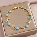 Vergoldetes Blattarmband mit himmelblauen Ovalsteinen und weißen Zirkonia-Markisensteinen - Himmelblauer und Weißer Edelstein Goldrebe Stil(DQ-W-3316)