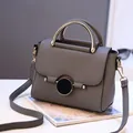 Grey litchi grain leather crossbody bag with round magnetic buckle and gold-tone handle - Dark Gray