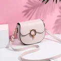 Pale pink saddle bag with cat ear metal clasp and adjustable shoulder strap for women - White