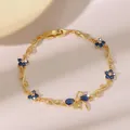 Eleganteres vergoldetes Armband mit blauen Zirkonblumen und Schmetterlingsanhängern - Blaue Blume und Schmetterling Gold Stil (DQ-W-3391)