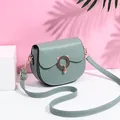 Bean green saddle bag with gold cat-ear metal buckle and matching shoulder strap - Green